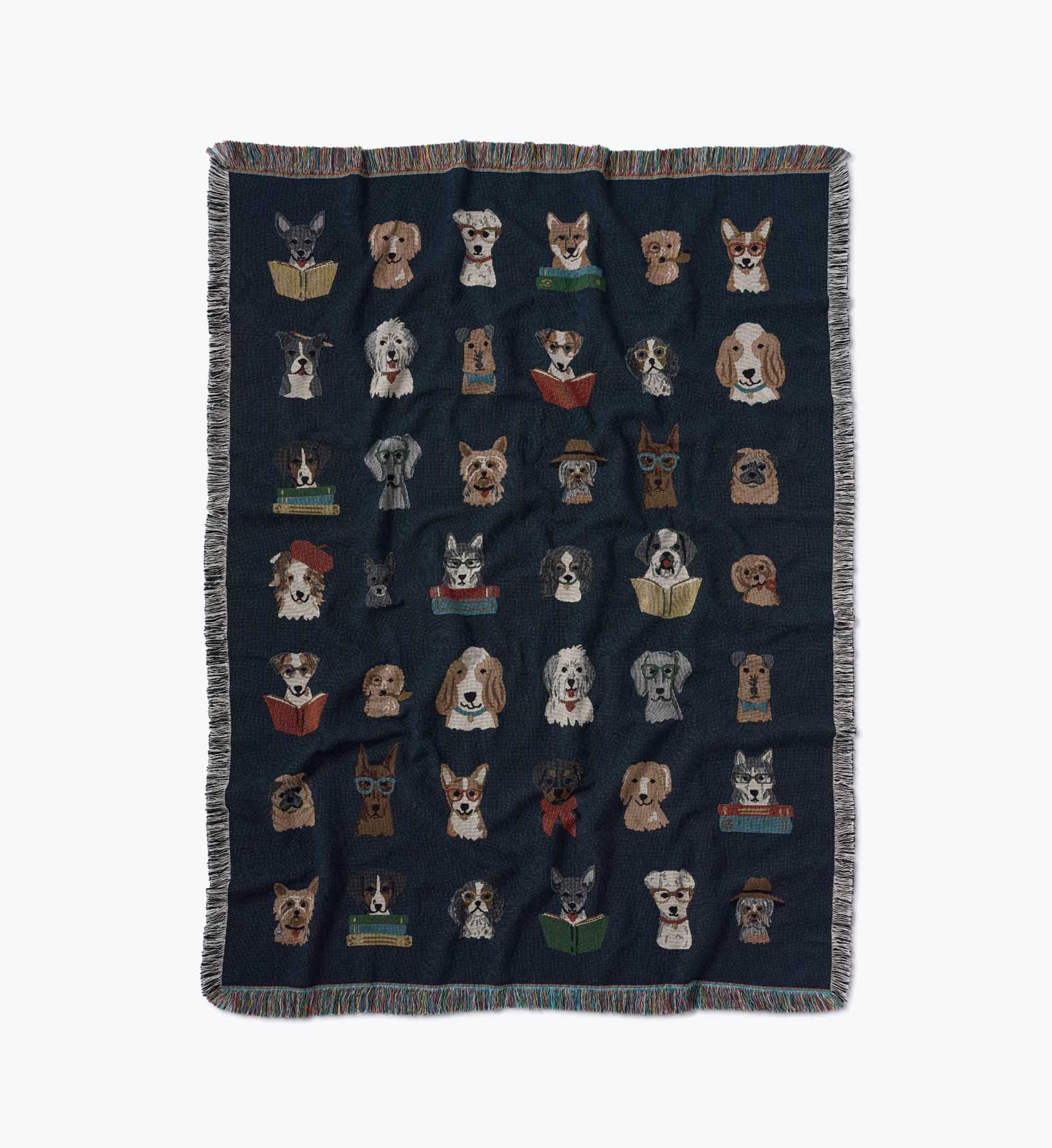 Blanket with embroidered dog designs on a dark background